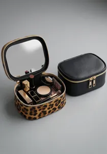 Leopard and black cosmetic bags detail view with built-in mirror and spacious storage.