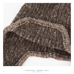 Detailed view of winter warm knitted wool hat, thick cozy texture, stylish brown design.