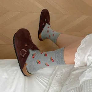 Comfortable autumn winter thermal crew socks with cute floral print paired with stylish brown clogs.