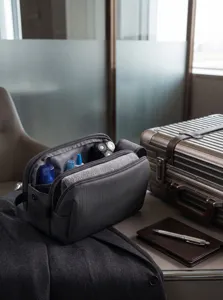 Close-up detail of the multi-compartment travel toiletry bag interior and storage setup.