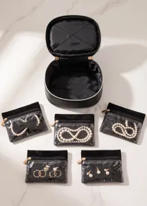 Multifunctional black cosmetic and jewelry organizer bag set with clear sub pouches for travel.