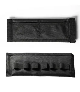 Detailed view of black nylon strap organizer with elastic loops for convenient daily storage.