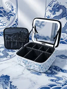 Portable LED makeup case detail view, featuring lighted mirror, adjustable dividers and brush pouch.