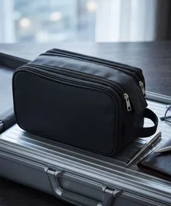 Black multi-compartment travel toiletry bag cosmetic organizer with secure zippers.