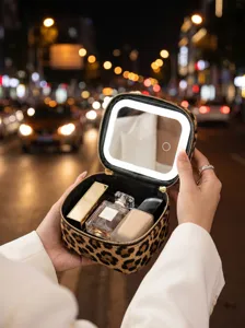 Close-up of leopard print makeup bag with LED lighted mirror, portable travel cosmetic case.