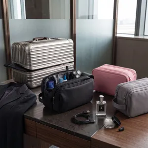 Waterproof travel toiletry bag with large capacity, multiple zipper compartments and durable handle.