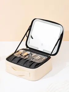 Portable makeup case with built-in LED lighted mirror and handy brush holder compartments.