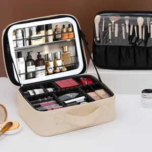Portable travel makeup bag with LED light mirror and adjustable dividers for cosmetic storage.