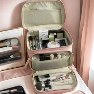 Pink PU leather large capacity makeup bag travel cosmetic organizer with multiple compartments.