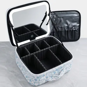 Large capacity portable makeup case with LED light mirror and adjustable dividers for travel.