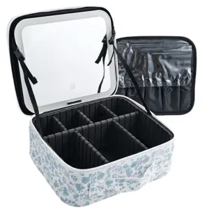 Portable makeup train case with LED lighted mirror and adjustable dividers blue floral design.