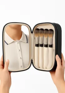 Sac de rangement portable pour pinceaux de maquillage de voyage avec miroir et outils.