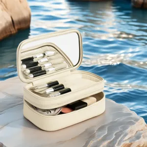 Sac de maquillage de voyage double couche portable avec miroir et pinceaux pour femmes.