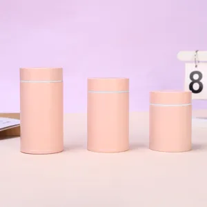 Close-up display of three portable mini solid color insulated pocket cups in pink.