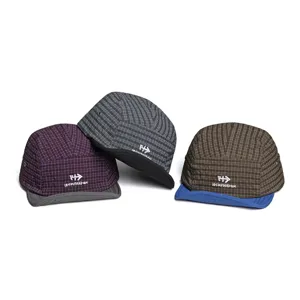 Detailed view of stylish quick-dry 5-panel camp cap with grid pattern and front embroidery.