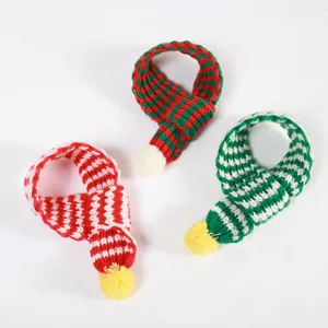Mini knit pet scarf with pom-pom, cute winter accessory for cats and dogs, colorful wool collar.