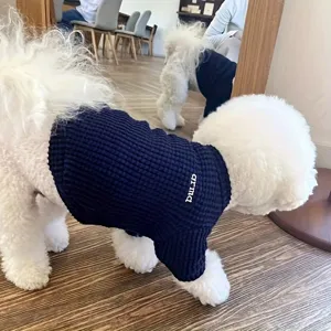 Waffle-knit pet shirt detail, soft dark blue fabric for small dogs and cats, comfy wear.