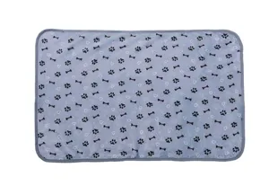 Thickened warm flannel pet blanket with cute paw and bone prints detail closeup view.