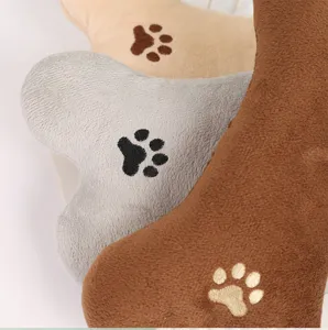 Pet plush bone toy with paw print embroidery, soft cat and dog chew pillow for daily fun