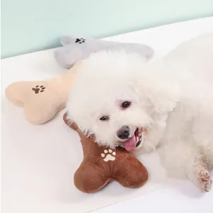 Cute pet plush bone toy with cute paw embroidery, perfect for dog teeth grinding and daily play.
