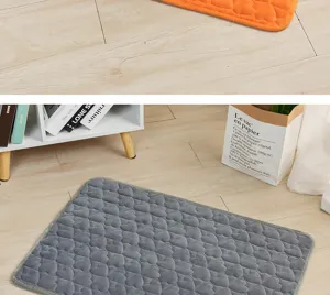 Flannel pet mat detail view showing soft heart-embossed texture and cozy grey fabric setup.