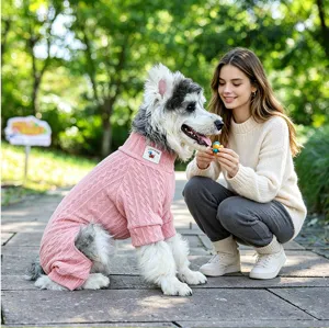 Pet dog pink cable knit sweater detail showing warm fleece texture outdoor lifestyle view