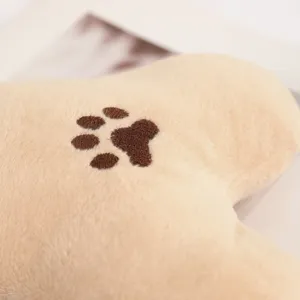 Pet plush toy bone shaped beige stuffed animal with cute brown embroidered paw print for dogs cats