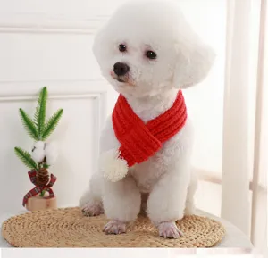 Cozy red knitted pet scarf with pom-pom for cats and dogs, warm winter pet accessory.