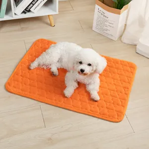 Cozy flannel pet mat for dogs and cats, soft warm orange sleeping bed for winter.