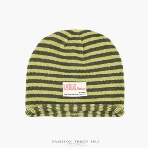 Green striped knitted beanie hat, casual slouchy cuffed skull cap for women autumn winter warm.