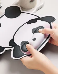 Close-up detail of cute panda wrist rest mouse pad with memory foam for office typing support.