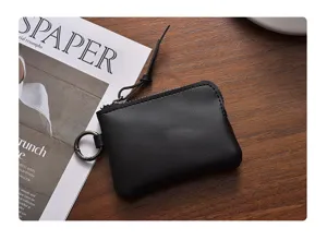 Black minimalist mini coin purse portable zipper pouch with keyring for women daily use.
