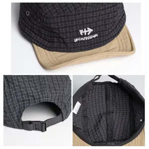 Detailed view of grid quick-drying baseball cap showing contrast khaki brim and adjustable strap.