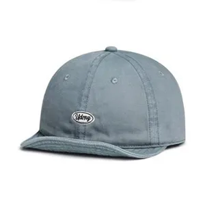 Grey short brim baseball cap with Udmy embroidered patch detail, soft crown cotton hat.