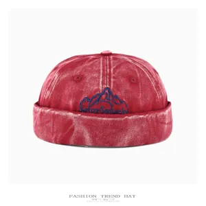 Vintage washed denim sailor cap with mountain embroidery, stylish hip-hop streetwear hat.