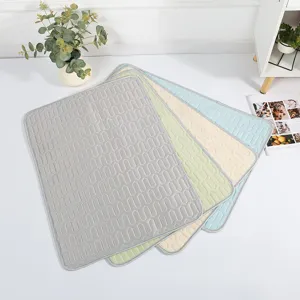 Cooling pet mat for summer, breathable ice silk dog and cat pad with stylish geometric pattern.