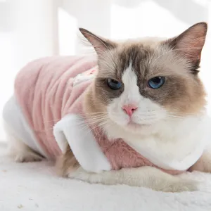 Cute pet warm vest in pink and white plush, designed for cats and small dogs in autumn winter.