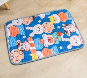 Blue quilted pet mat detail view featuring cute cartoon animal prints and soft fabric surface.