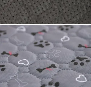 Washable dog pee pad detail close-up, showing quilted soft fabric surface and anti-slip backing.