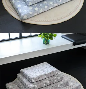 Soft flannel fleece pet blanket detail, warm dog sleeping mat with cute star and paw prints.