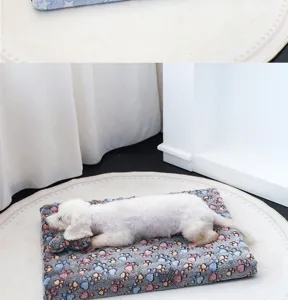 Cozy fleece pet sleeping mat with colorful paw print design for small dogs winter warmth detail view