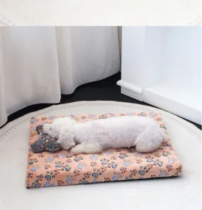 Cozy flannel dog bed with cute paw print pattern, soft plush warm mat for small medium pets.