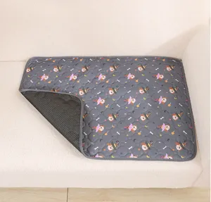 Washable dog pee pad with cute Halloween pattern, absorbent and reusable pet training mat.