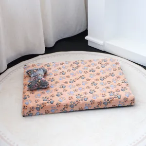 Cozy flannel pet mat with cute paw prints and matching bone toy, perfect for small dogs winter.