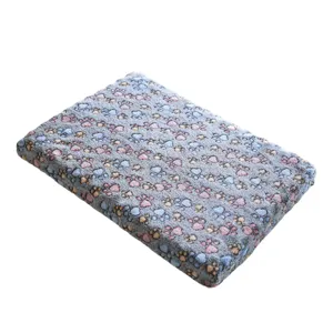 Warm fleece pet dog bed mat with cute paw print pattern, soft winter sleeping pad for dogs.