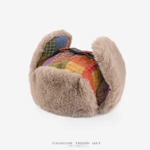 Winter plush ushanka hat with retro colorful plaid pattern and warm ear flaps for cold days.