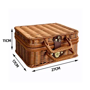 Detailed view of vintage woven storage basket showing 27x17x11cm dimensions with leather buckle.