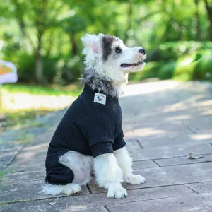 Black knit four-legged pet sweater for dogs and cats, cozy elastic winter pet apparel.