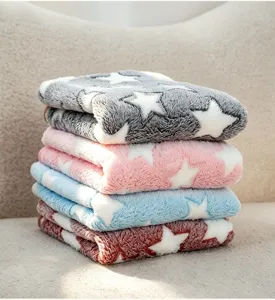 Flannel pet blanket with cute white star pattern, soft and warm fleece mat for dogs and cats.