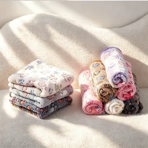 Soft flannel pet blanket with cute paw print design, warm cozy sleeping mat for dogs and cats.